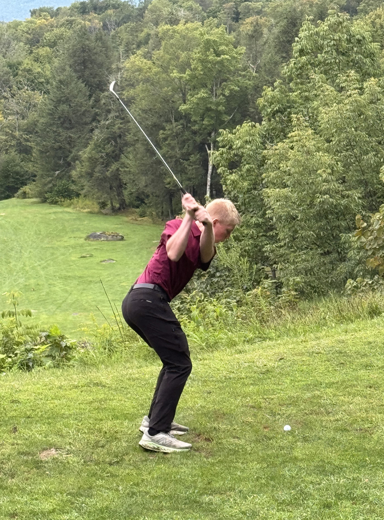 student golfing