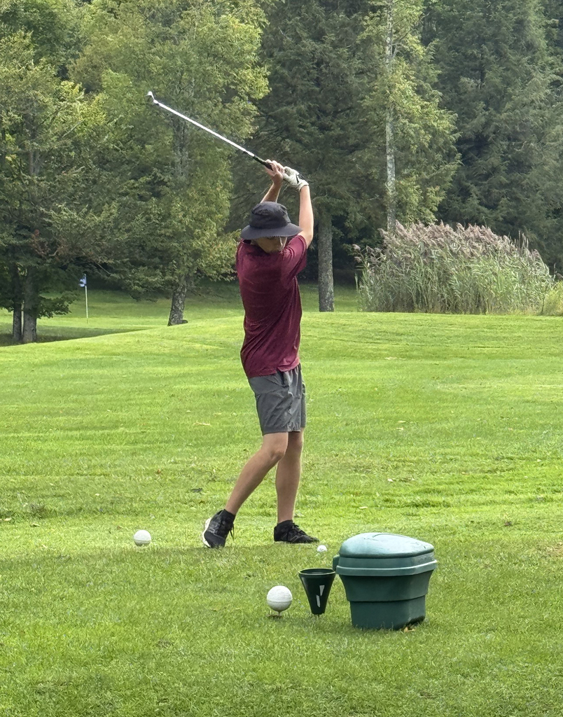 student golfing