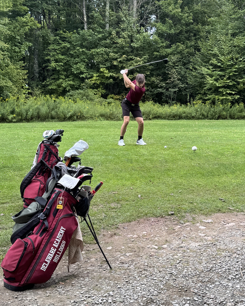 student golfing