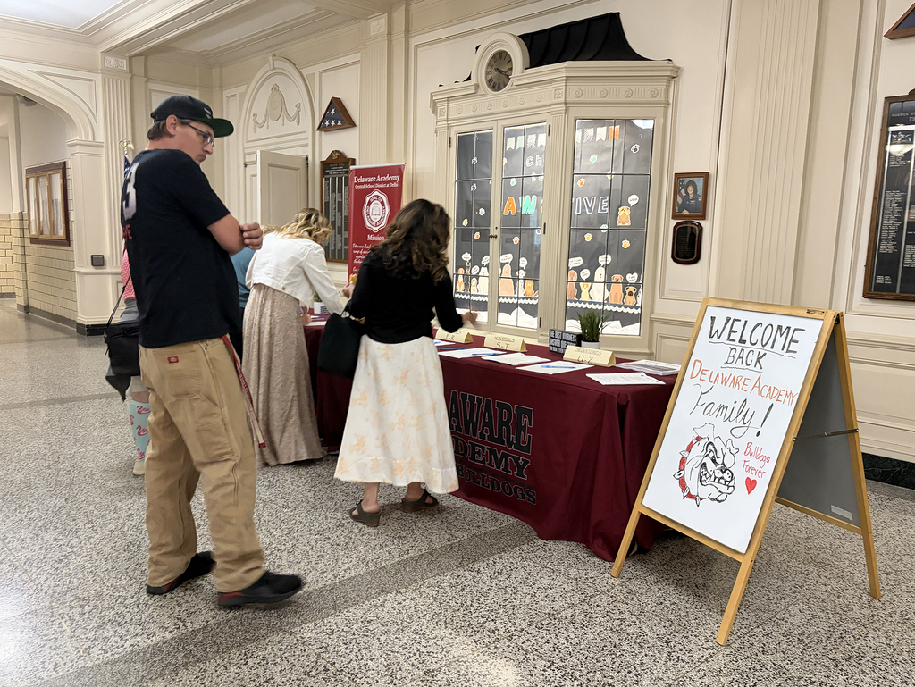 3 staff members at the registration table