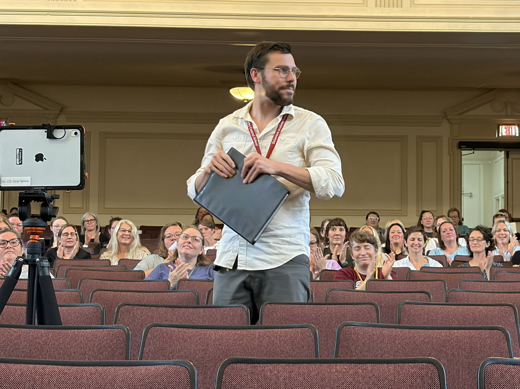 New Technology teacher David Engel is introduced in the auditorium