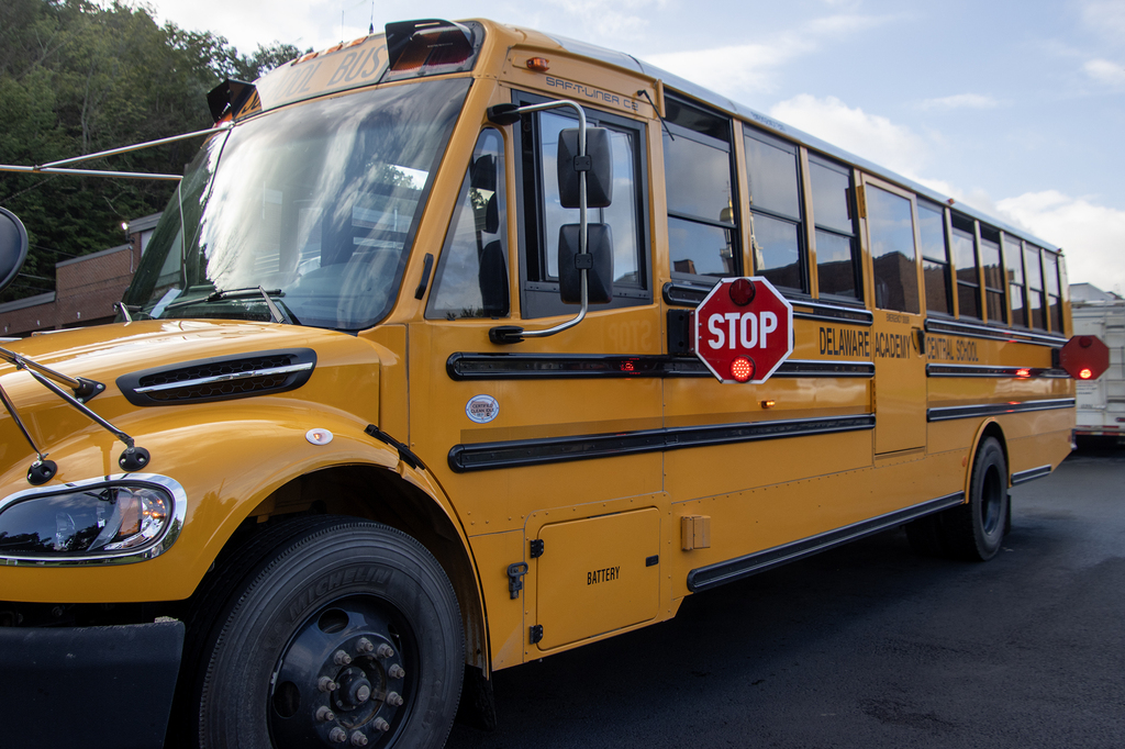 Delaware Academy school buse sith the Stop sign flashing