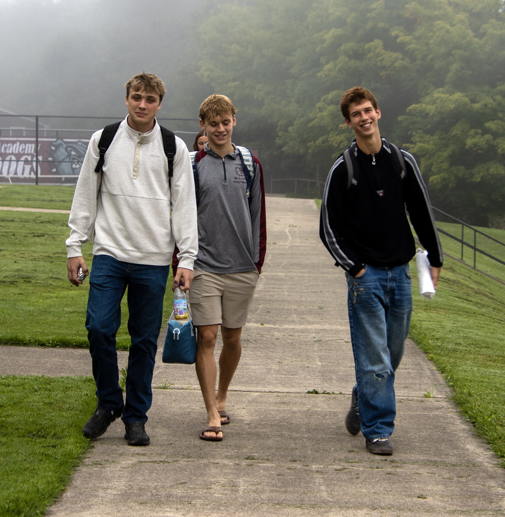 3 high school boys walking to school