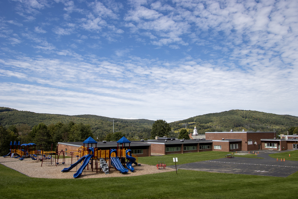 stunning clouds in the sky overlooking the elementary building