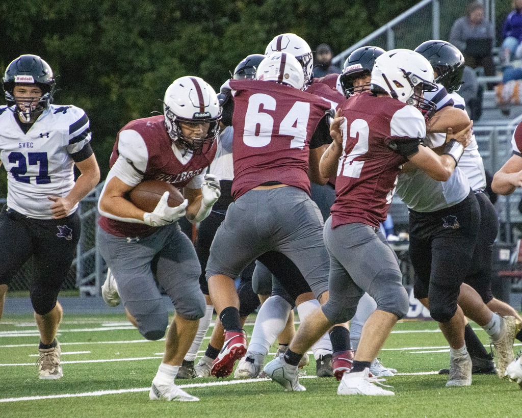 DA football player carrying the ball