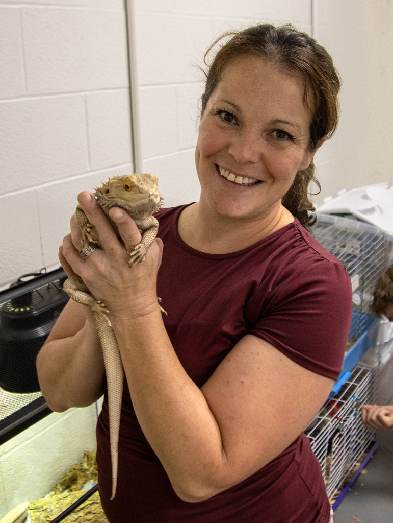 Mrs. Somers holds Ziggy the iguana