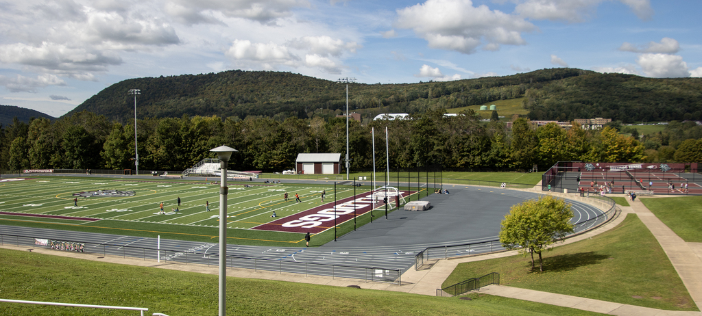 active kids on a football field, track, and tennis courts