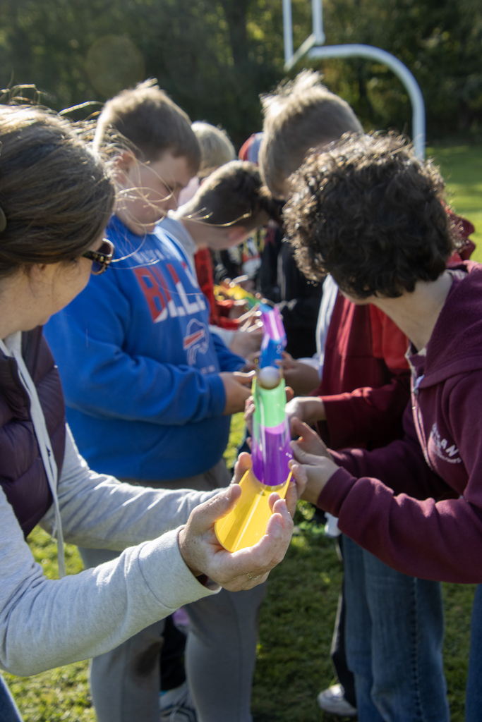 teachers and students form a ball roll track with movable pieces