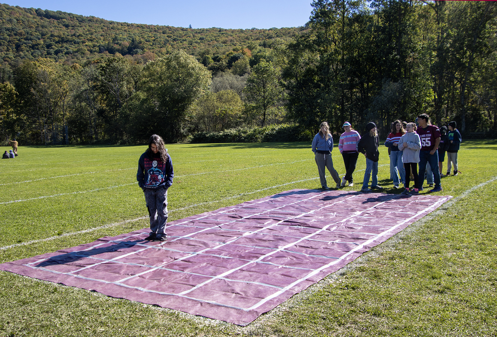 7th grade students try to guide one of their teammates through a "minefield" with spoken directions only