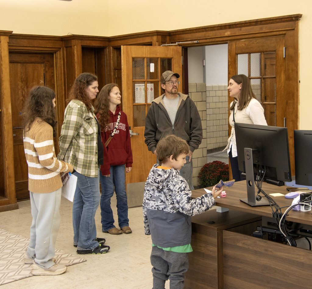 Special Education director talking to a family with several children