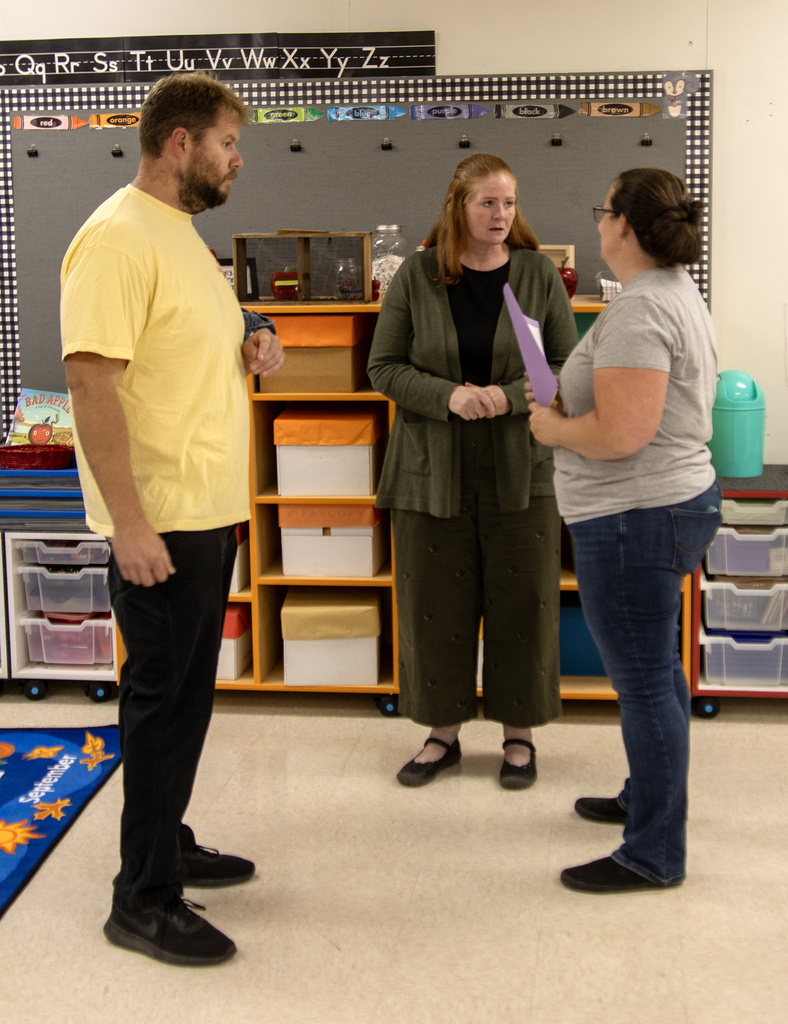 parents talk with Pre-K teacher