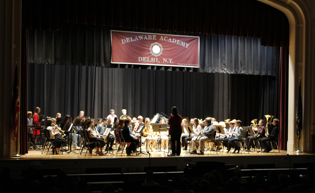full stage view of the concert band and conductor