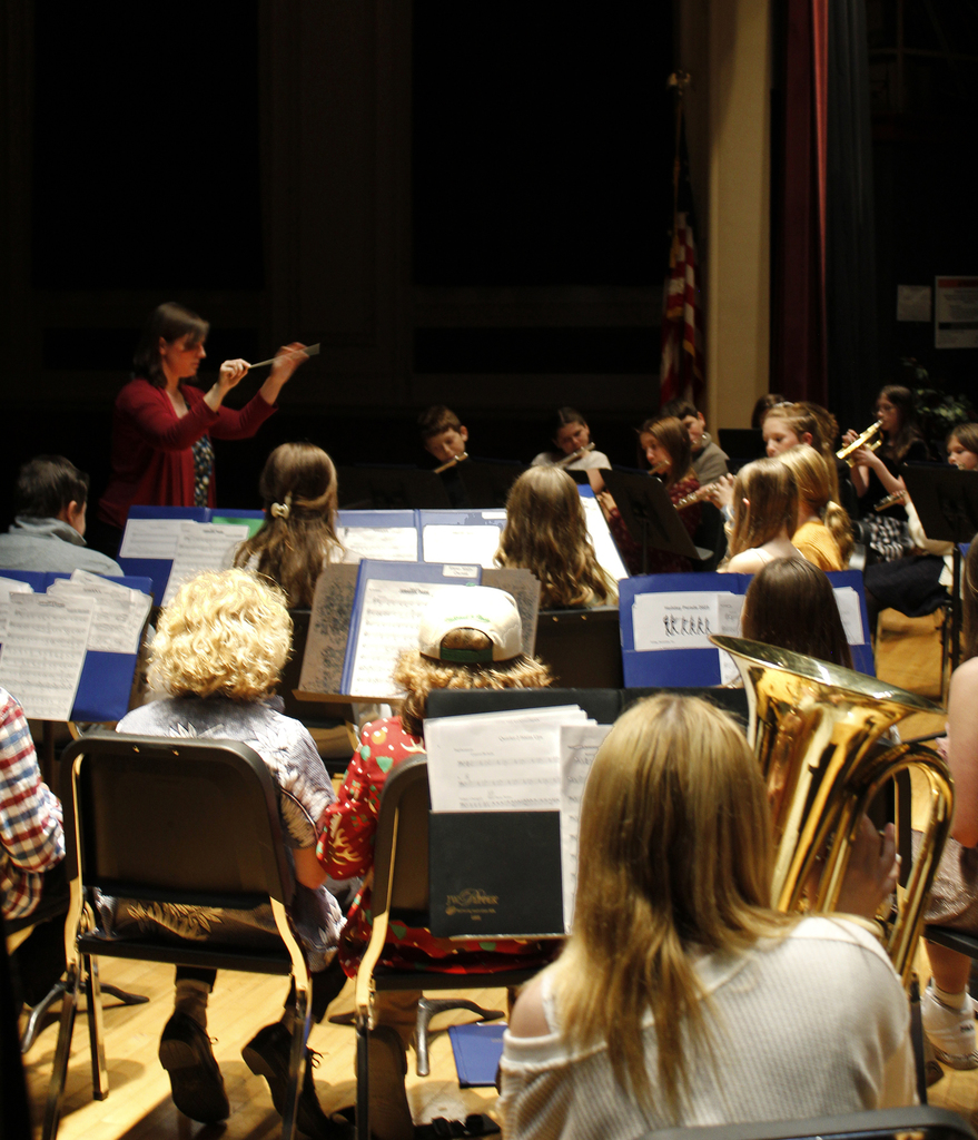 Band teacher conducts the band