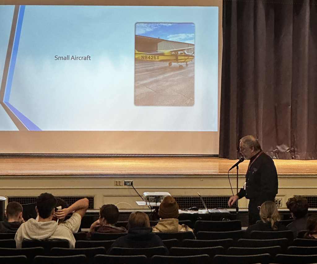 a presenter talks at the career fair 