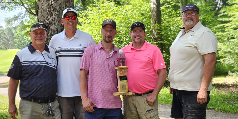 5 men stand with a golf trophy