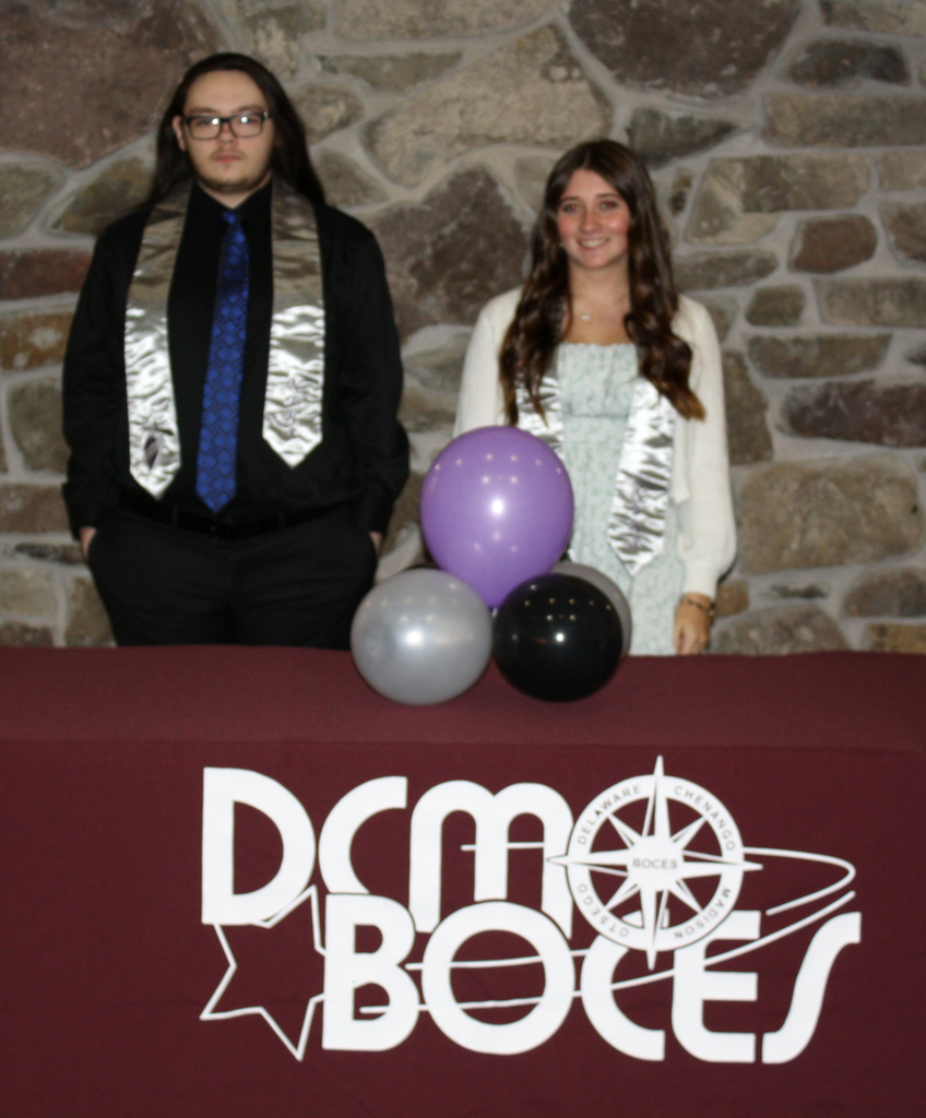 Students pose with Honr Society stoles behind a DCMO BOCES table