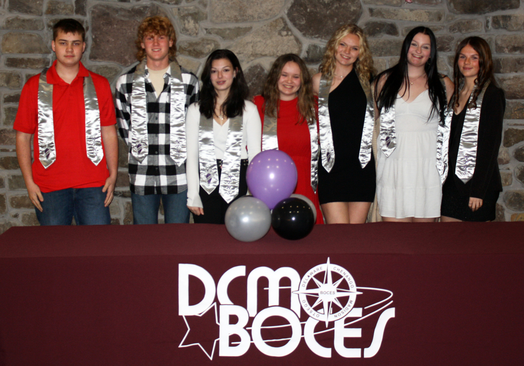 Students pose with Honr Society stoles behind a DCMO BOCES table