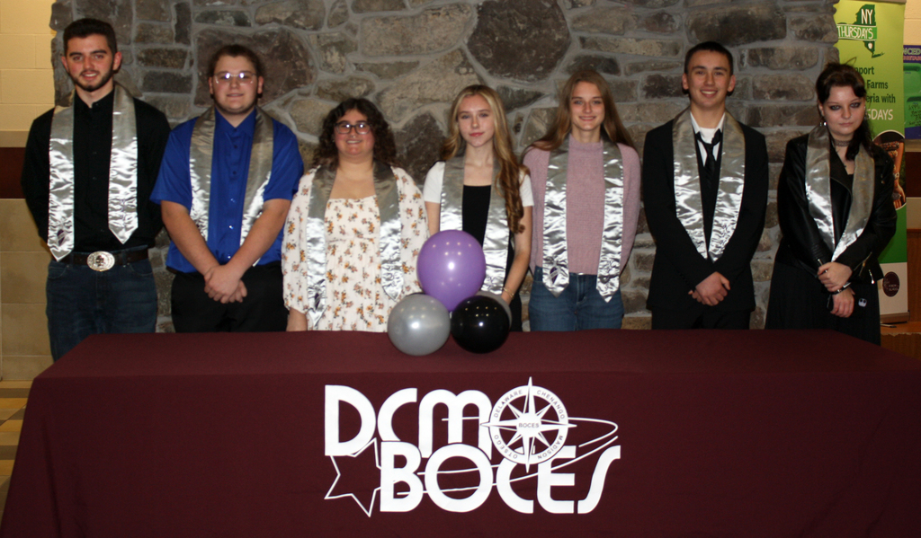 Students pose with Honr Society stoles behind a DCMO BOCES table