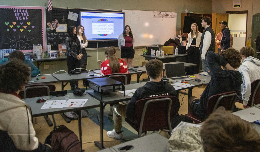 business students present to visitors
