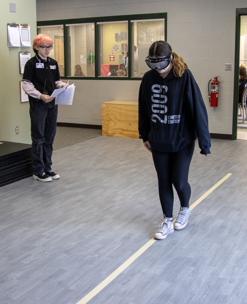 student supervises student drunk-walking