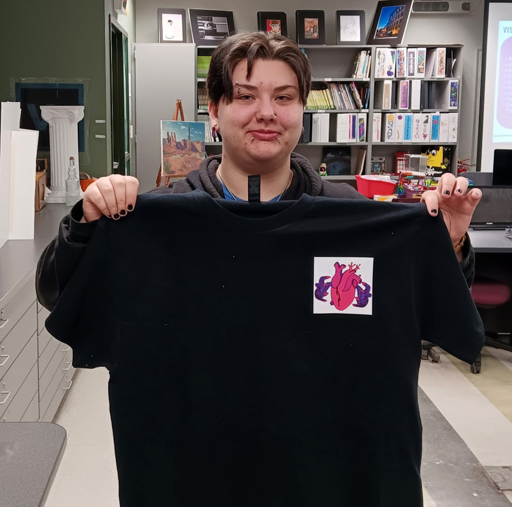 student shows finished t-shirt