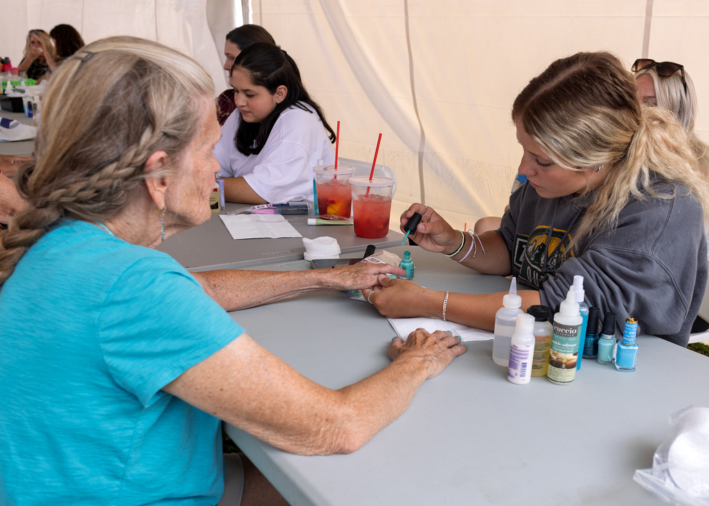 Cos student paints woman's nails
