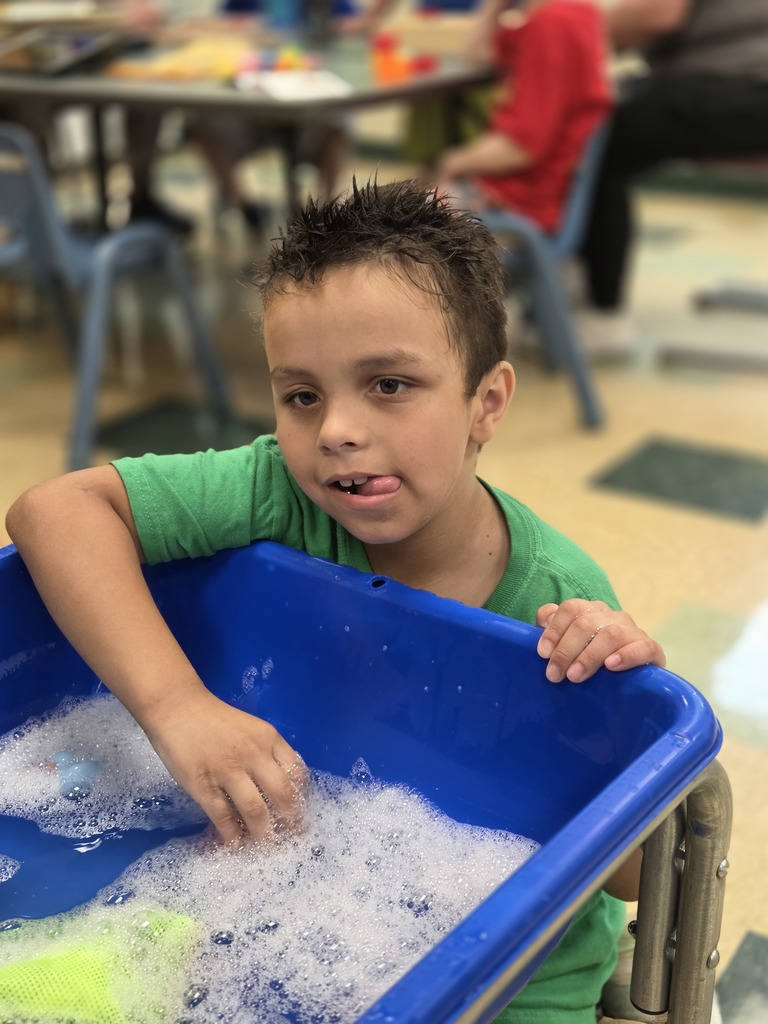 student plays in water