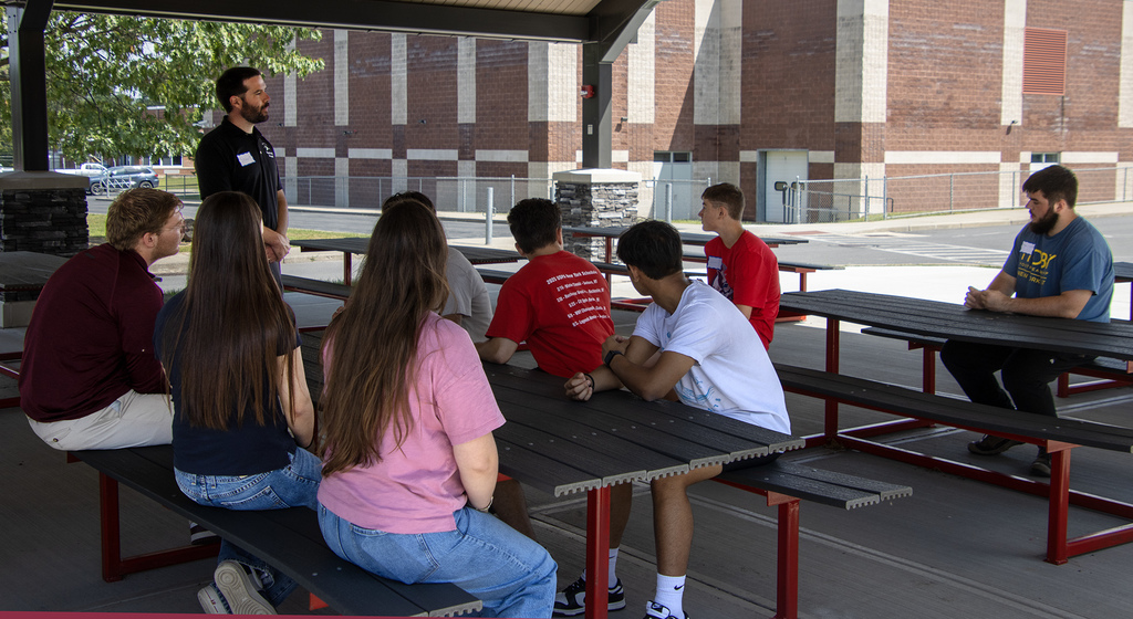 student answers question in group discussion