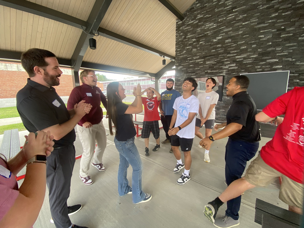students laugh as they do an activity
