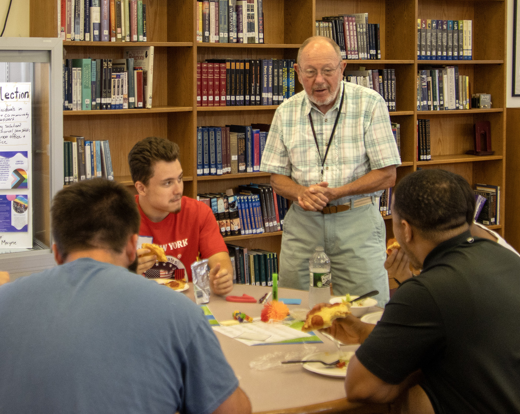 board member speaks to students