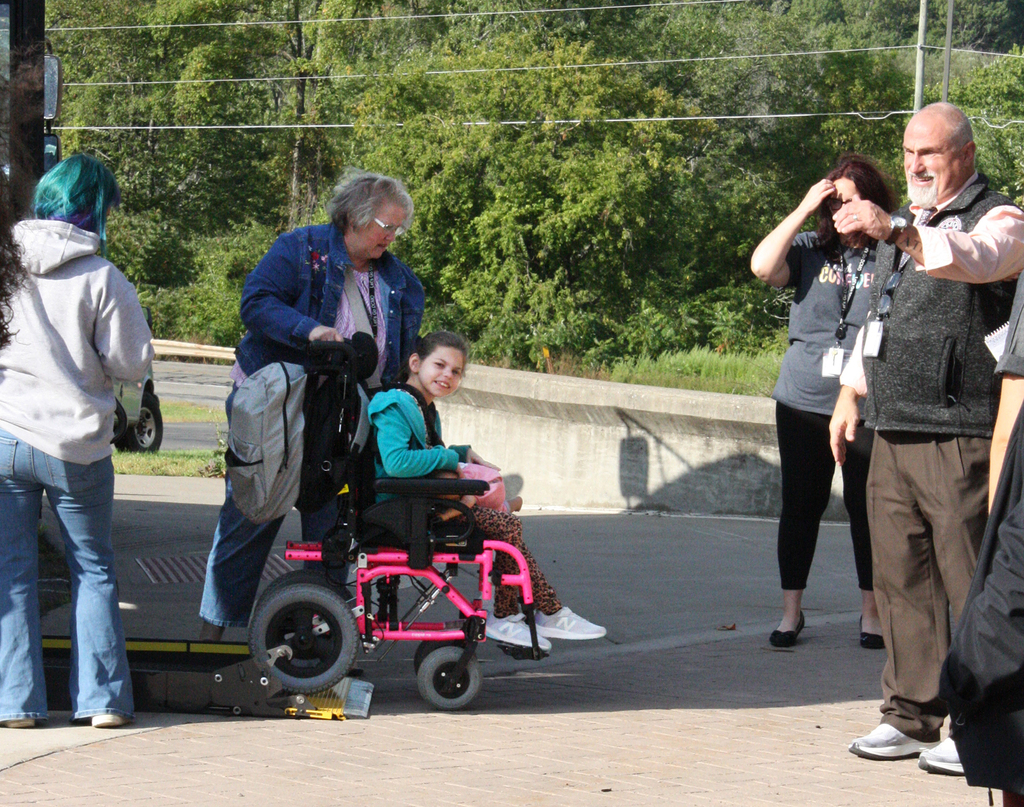 student in wheelchair arrives