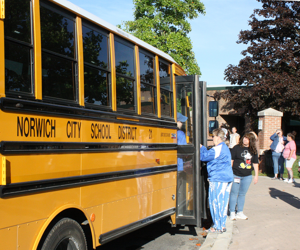 student getting off bus