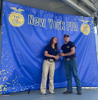 2 FFA students pose with ribbons