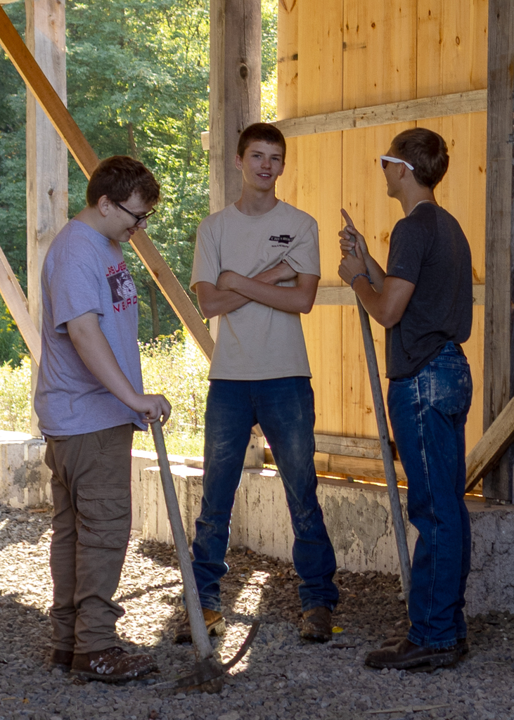 students with tools talking