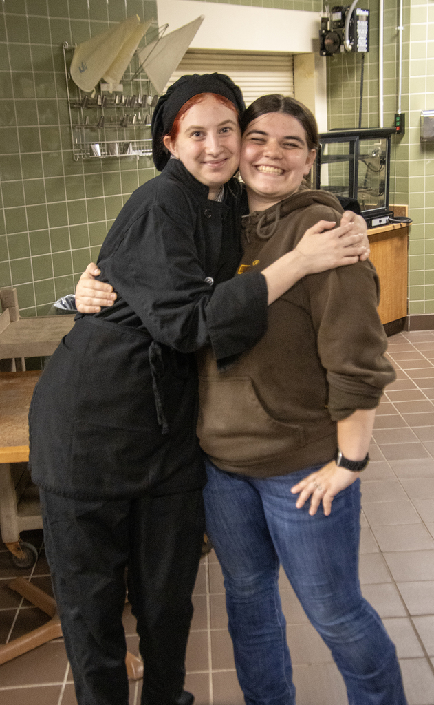 2 students hugging