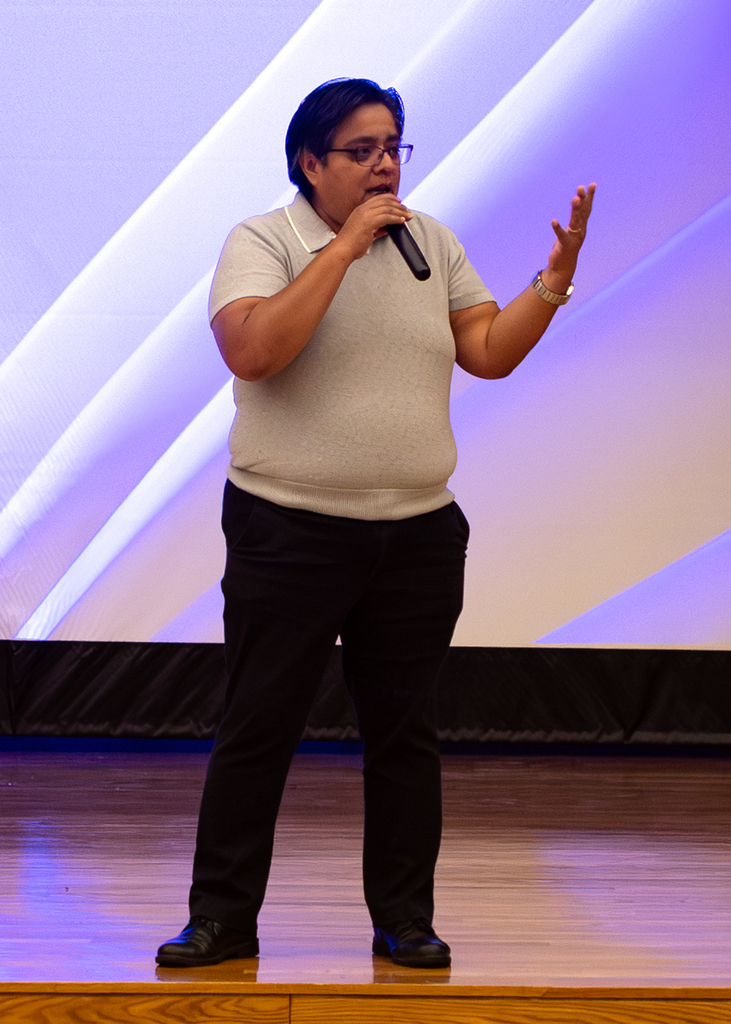 Pathy Leiva, Executive Director of Access and Opportunity Programs, speaks to students