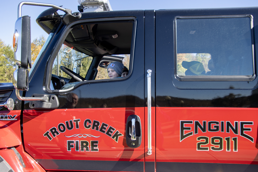 student sites in drivers seat of Trout Creek Fire Department vehicle