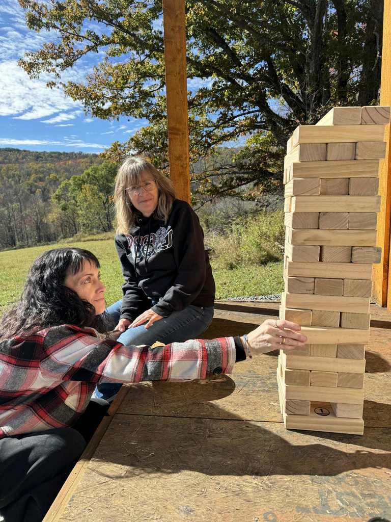 2 adults playing jenga