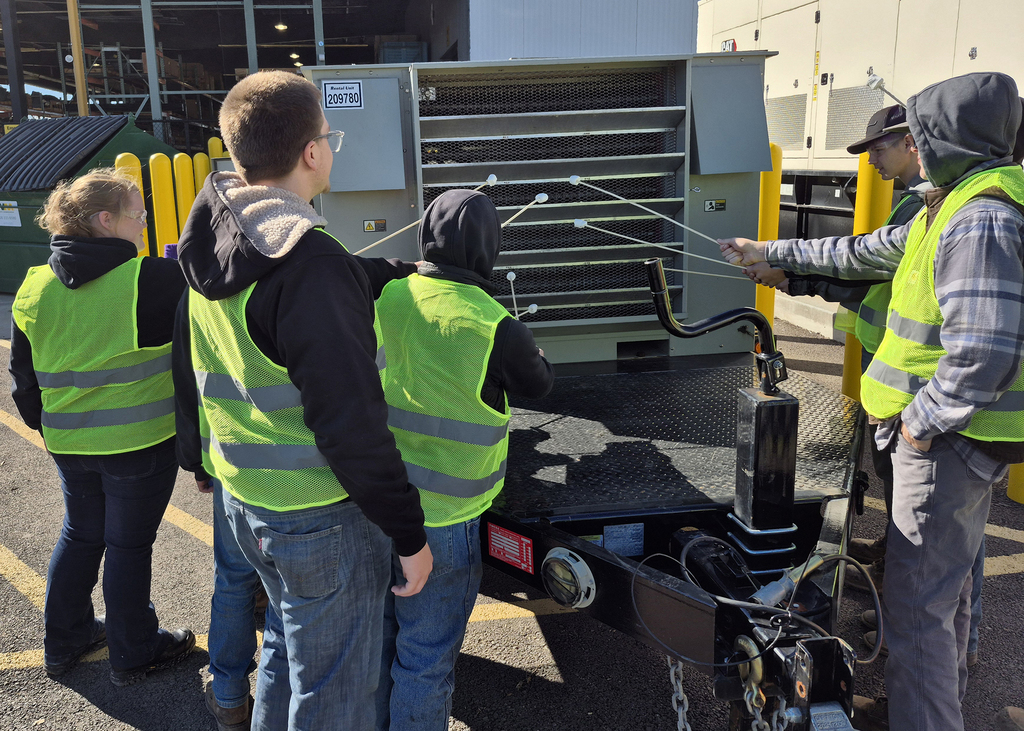 Students roast marshmallows on heat from power inverter
