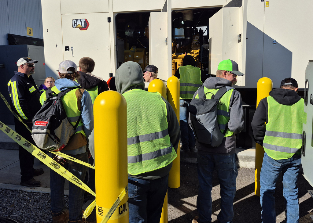Milton Caterpillar employee demonstrate equipment to students