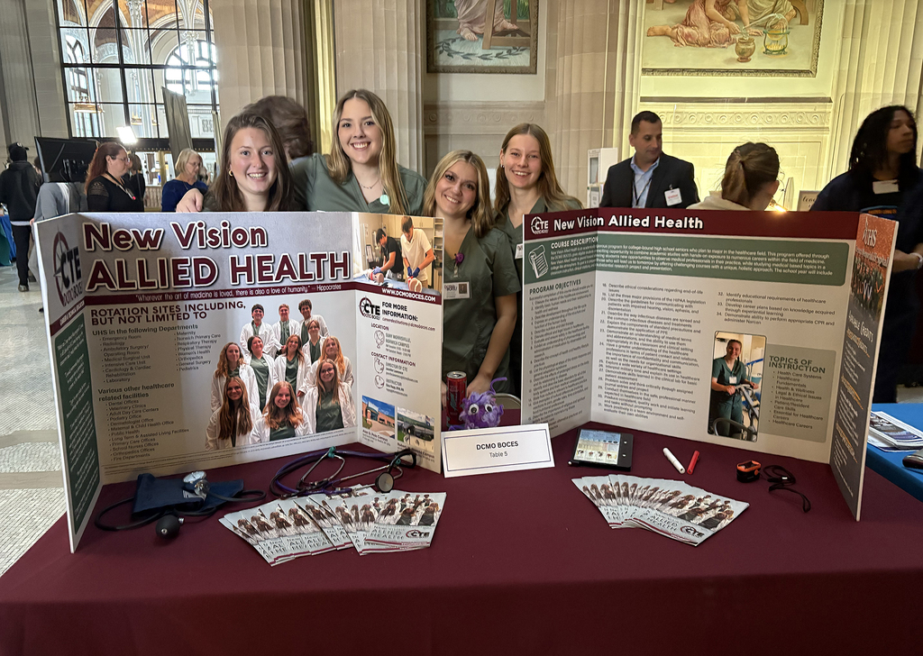 New Visions students with display