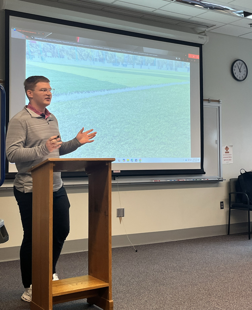 New Visions student delivers speech at podium