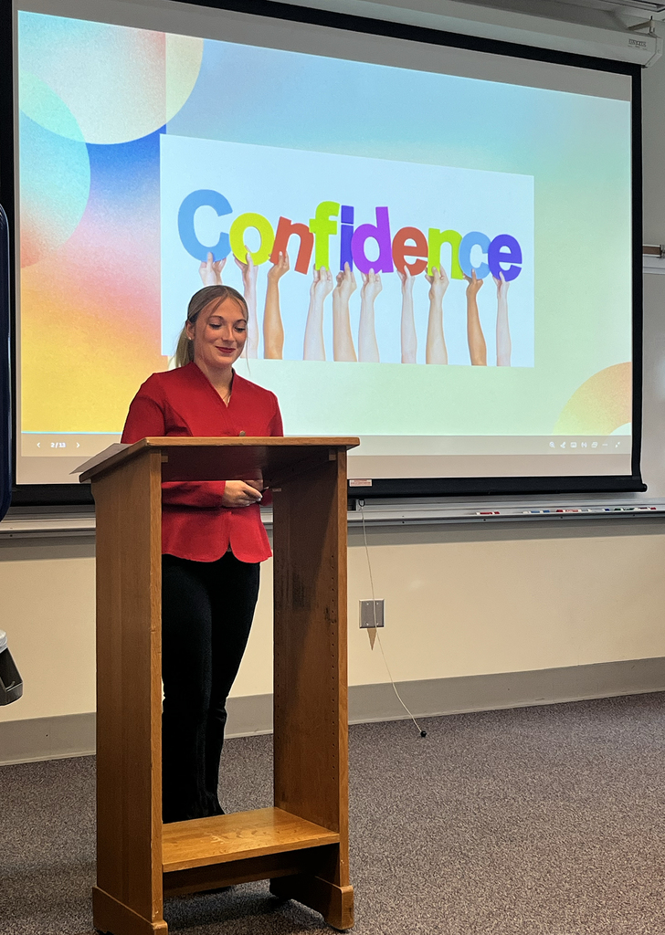 New Visions student delivers speech at podium