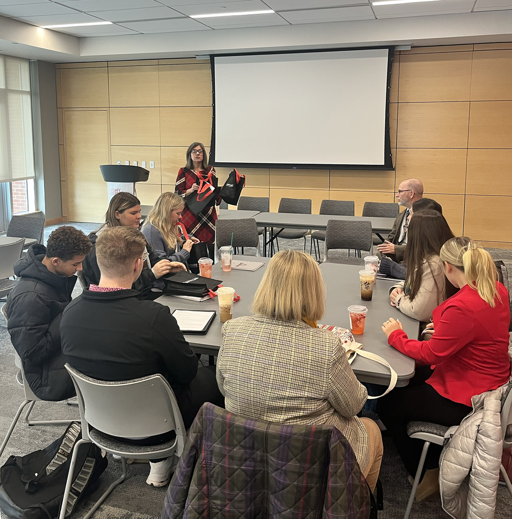 New Visions students listen to Pam Hilton in classroom