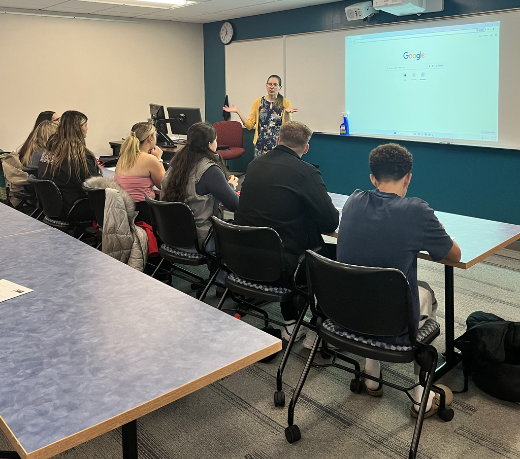 Professor lectures to class that includes New Visions students