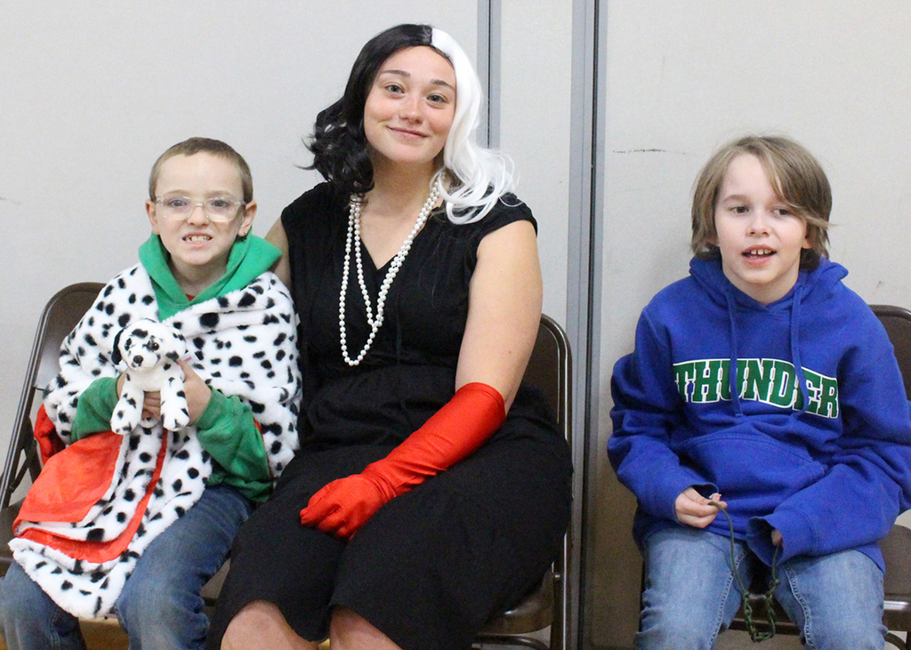 2 students and an adult in costume on Halloween