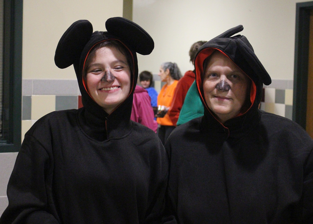 2 adults in mouse costumes