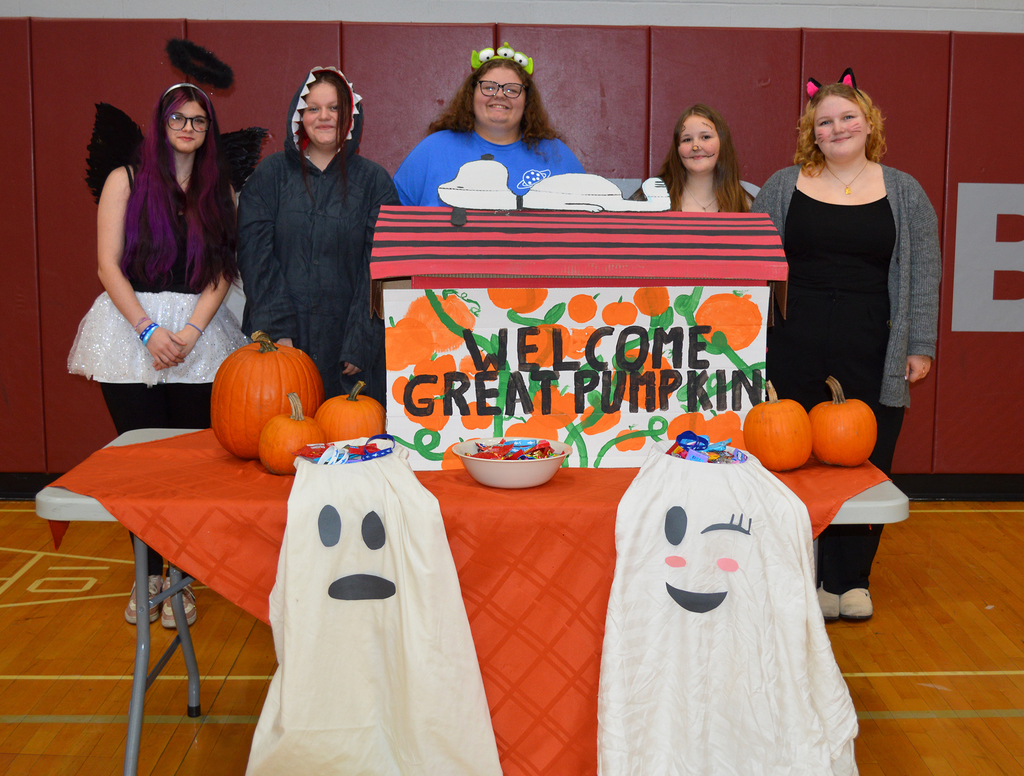 students in costume at Welcome Great Pumpkin table