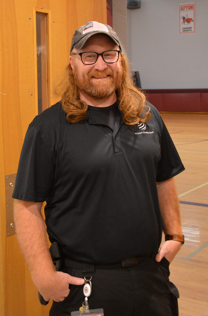 School resource officert wearing a funny wig hat