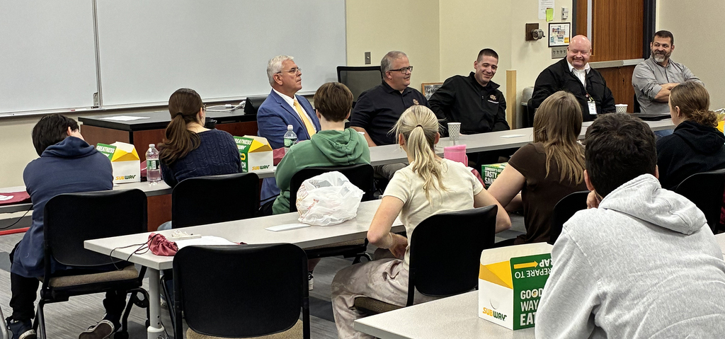 angelino and panel in front of students